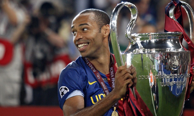 Thierry Henry holds the Champions League trophy